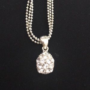 Silver-tone necklace with teardrop pendant.